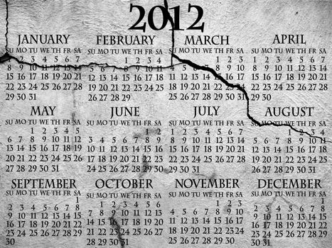 2012 complete calendar in black text over cracked cement background, tombstone or bad house block foundation.