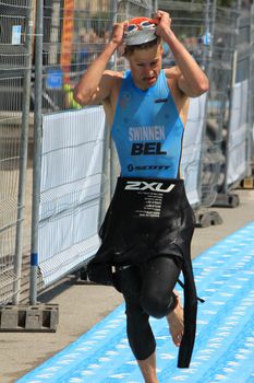 GENEVA, SWITZERLAND - JULY 24 : one unidentified male runner after the swimm race at the international Geneva Triathlon, on july 24, 2011 in Geneva, Switzerland