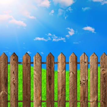 wooden fence against the blue sky