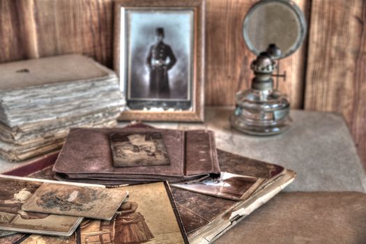 Old photos in sepia,books,albums on wooden background.