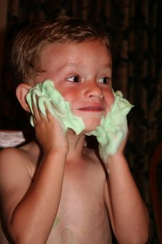 Young boy eager to shave