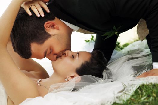 Newly-married couple in park