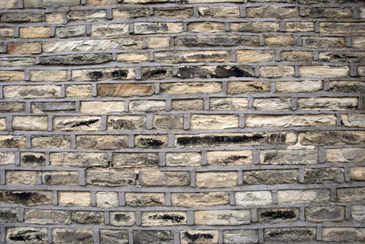 A wall of Yorkshire Stone with cement pointing