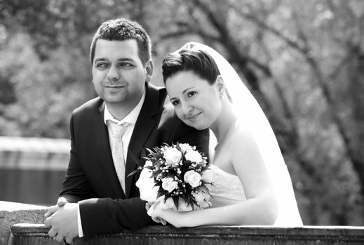 Newly-married couple in park