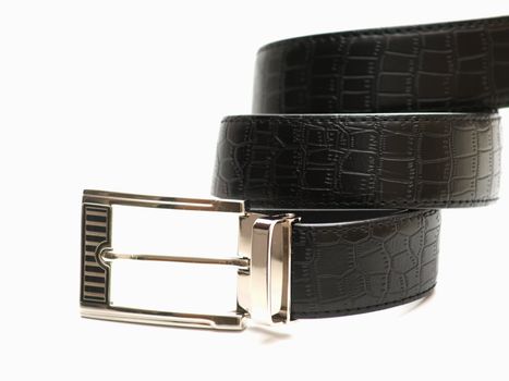 Black leather belt on white background 