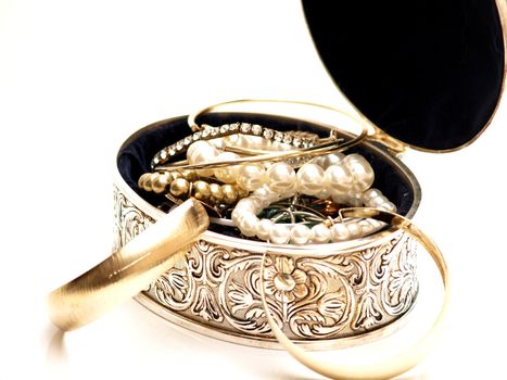 Jewelery box with nice pattern and full of jewelries on white background 