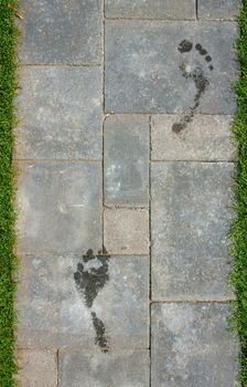 Wet foot steps on stones