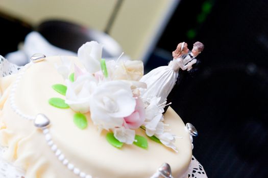 wedding cake decorated with figures of people