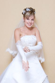 beautiful bride puts on a long white glove