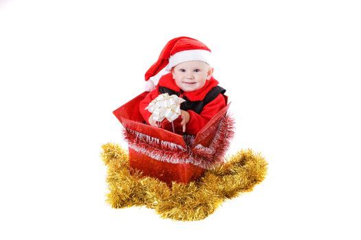 infant with gifts in the decorated christmas box