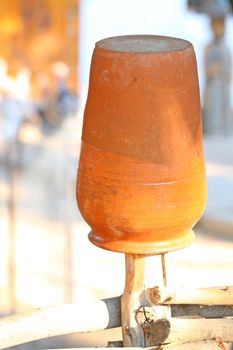 Close up of old orange jug