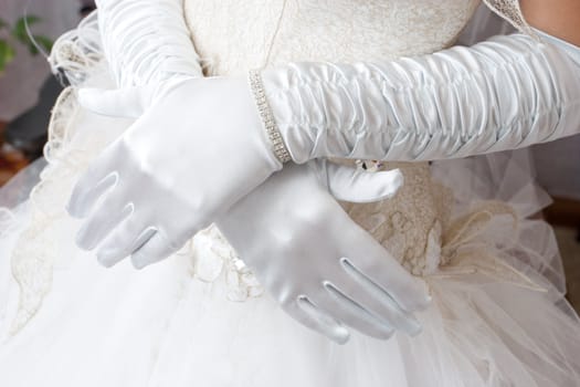 white gloves of the bride