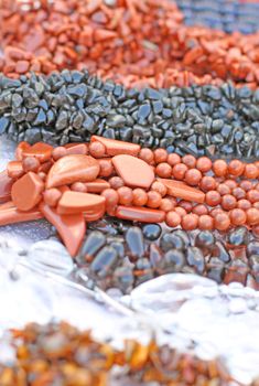 Close up of beads made of black and brown avantyurin gems.