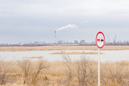 pollution of the environment as a smoke of a chimney of a factory and the sign