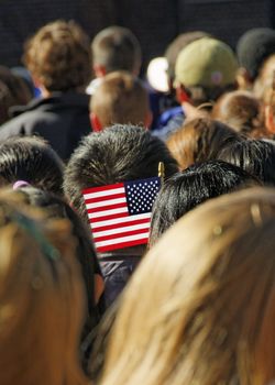 U.S. Flag amid a crowd.