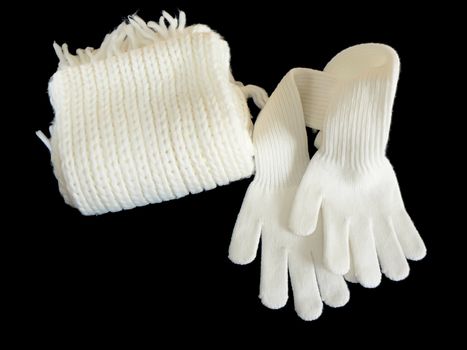 White woolen Scarf and gloves on black background