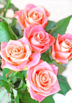 Close up of the cross shaped bouquet of five roses