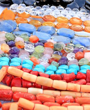 Close up of many different colorful gem beads