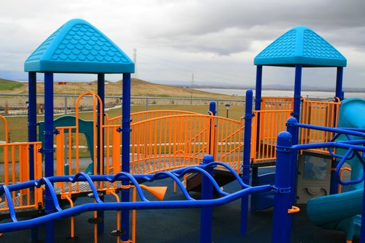 New playground in a schoolyard in summer.
