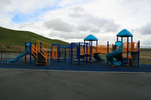 New playground in a schoolyard in summer.
