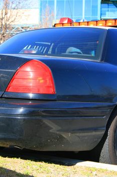 Police car parked in a parking lot.
