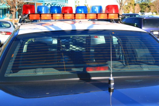 Police car parked in a parking lot.
