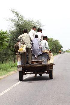 small open car with people