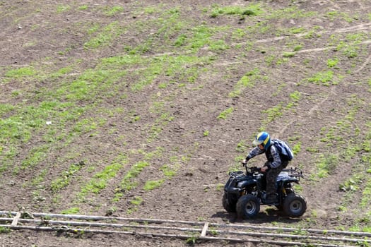 young man on quad bike during a race