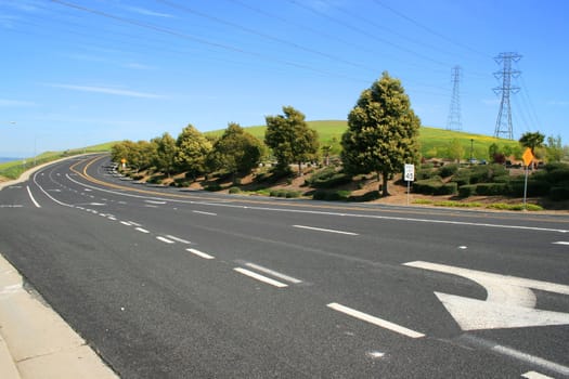 Long infinite road on a sunny day.
