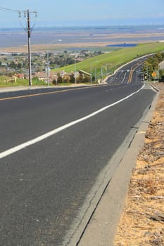 Long infinite road on a sunny day.
