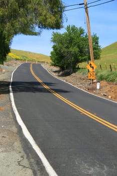 Long infinite road on a sunny day.
