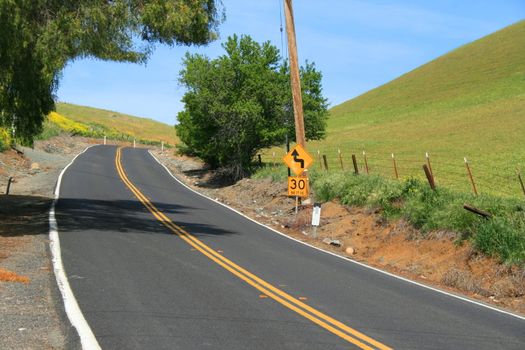 Long infinite road on a sunny day.
