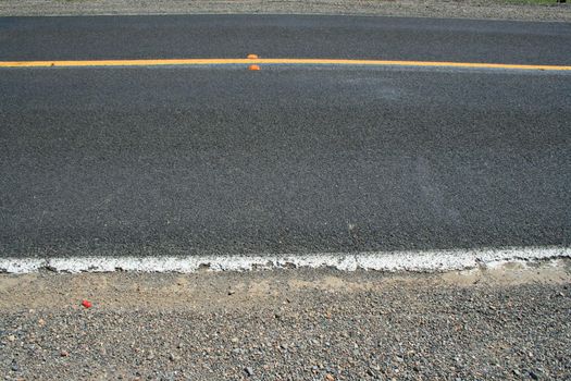Close up of a road showing patterns.
