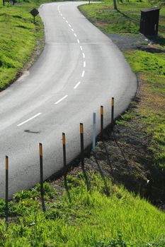 Winding road in a park on a sunny day.
