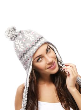 beautiful smiling woman wearing a winter cap on white background