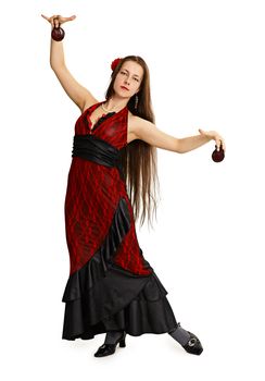 Young girl in red dress performs Spanish dance isolated on white background