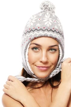 cute smiling woman wearing winter cap on white background