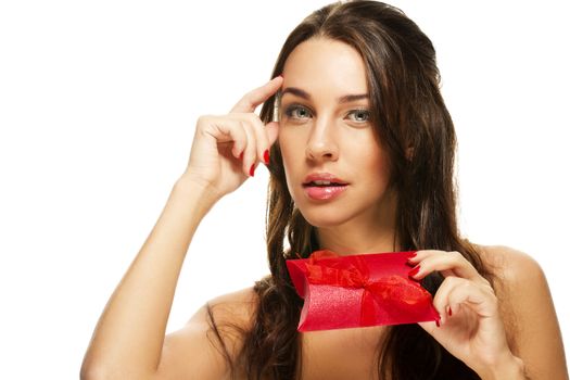 thinking beautiful woman holding red present on white background