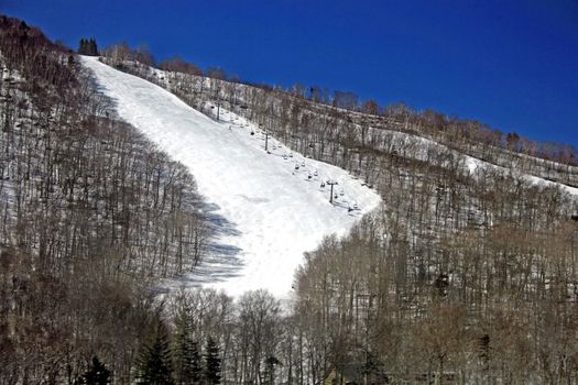 A ski slope and lift in the winter