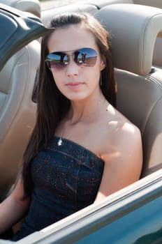 Outdoor shot of beautiful brunette woman with long hair