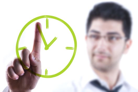 Young business man drawing a clock on a glass board