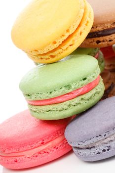 A french sweet delicacy, macaroons variety closeup.  White background.