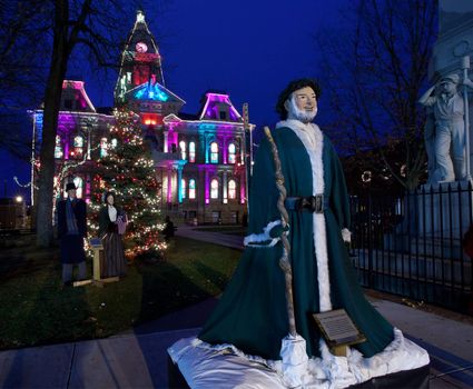 CAMBRIDGE, OHIO - NOVEMBER 24: Christmas lighting on the old Court House building in Cambridge Ohio on November 24, 2011. This annual event uses Dickens characters on the main street.
