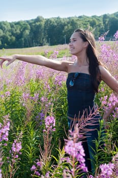 Outdoor shot of beautiful brunette woman with long hair