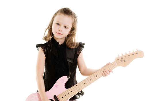 Portrait of pre-teen girl playing a guitar isolated on white
