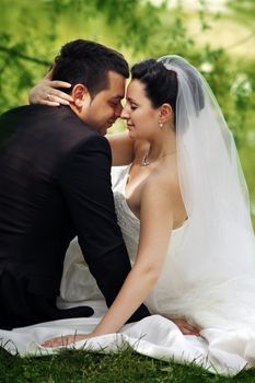 Newly-married couple in park