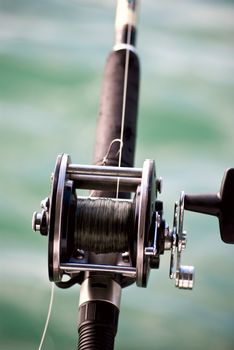 Fishing rod with the sea on background