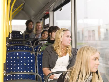 Row of young women on the bus