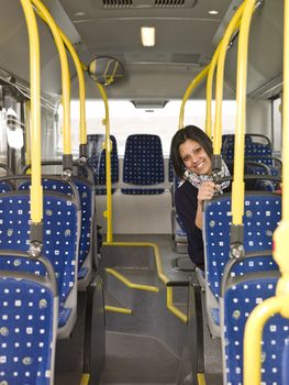 Happy woman alone on the bus