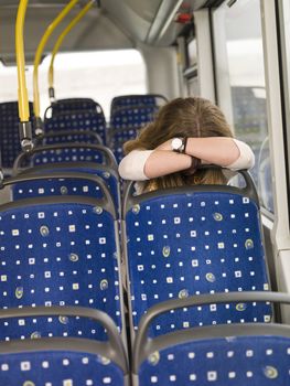 Sad woman alone on the bus